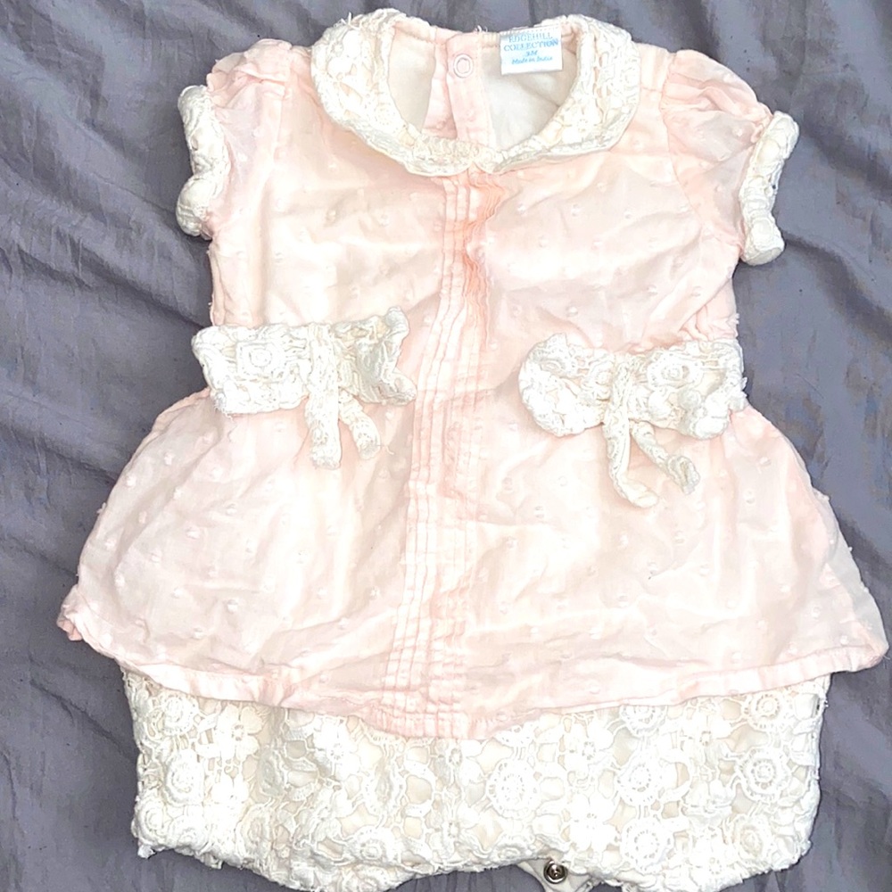 Baby girl romper with embroidered lace perfect for the summer.